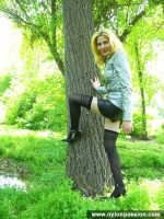Teen girl shows stockings outdoor