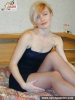 Pantyhose blonde MILF on a bed