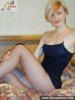 Pantyhose blonde MILF on a bed