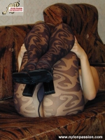Pantyhosed teen girl shows nyloned legs