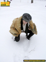 Pissing outdoor in the snow in winter day