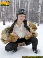 Pissing outdoor in the snow in winter day