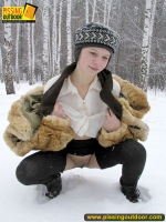 Pissing outdoor in the snow in winter day