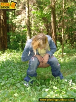 Pissing outdoor in the green forest