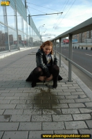 Outdoor pissing of teen blonde in the city street