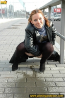 Outdoor pissing of teen blonde in the city street