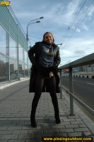 Outdoor pissing of teen blonde in the city street