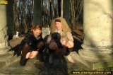 Two girls outdoor pissing on stone columns