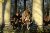 Two girls outdoor pissing on stone columns