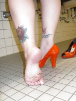 April washes her feet in the ladys room