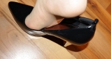 Foot torture with peas in high heels, leggings and corset