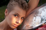 Girl posing near car