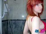 Redhead girlfriend strips in