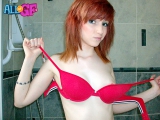 Redhead girlfriend strips in
