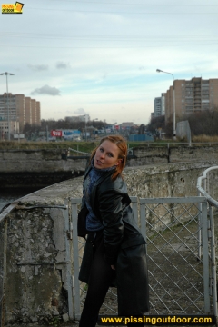 Pissing on the bridge over river - N