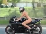 Topless Tattooed Chick Riding A Motorcycle