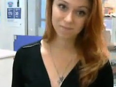 pretty-redhead-fooling-around-at-work