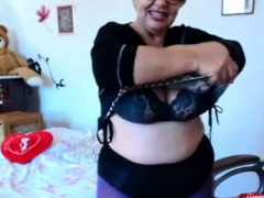 Granny playing with big boobs on webcam! Amateur!