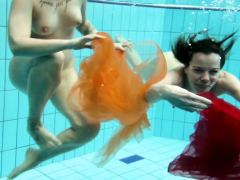 Two hotties submerged underwater