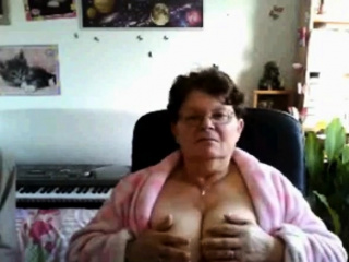 naughty granny flashing her big tits on cam