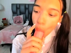 Cute amateur teen girl toying her pussy in bed on cam