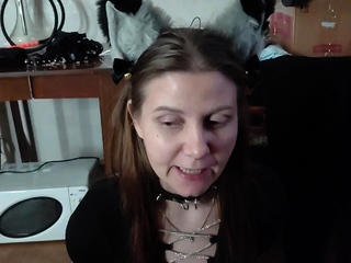 Sexy kitty eats from a bowl and licks her master's feet -